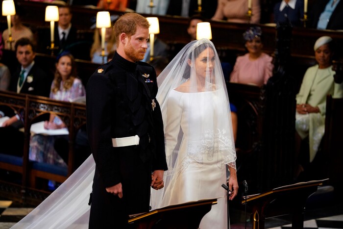 Britain's Prince Harry and Meghan Markle stand, prior to the start of their wedding ceremony, at St. George's Chapel in Windsor Castle in Windsor, near London, England, Saturday, May 19, 2018. (Dominic Lipinski/pool photo via AP)