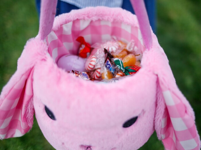 (Nicole Boliaux | For The Tribune) Margot Wood holds her Easter basket filled with candy and eggs during the annual Easter egg hunt put on by A Kid's Place Dentistry in Liberty Park in Salt Lake City on Saturday, March 31, 2018.