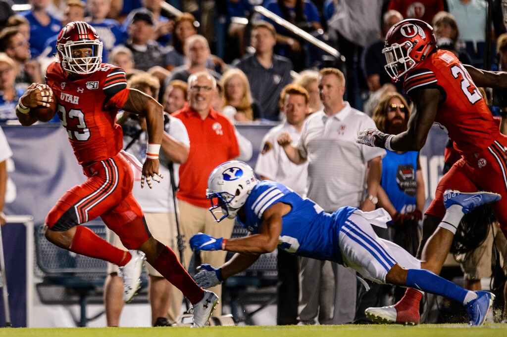 (Trent Nelson | The Salt Lake Tribune)
Utah Utes defensive back Julian Blackmon (23) runs an interception in the end zone for a touchdown as Brigham Young University (BYU) hosts the University of Utah, NCAA football in Provo on Thursday Aug. 29, 2019.