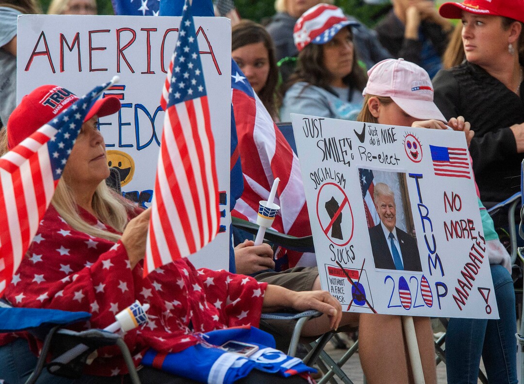 (Rick Egan  |  The Salt Lake Tribune)     Several people carried guns, but no one was wearing masks, as a couple of hundred people gather at the Provo Courthouse for the Utah County Freedom Rally on Friday, Oct. 2, 2020.