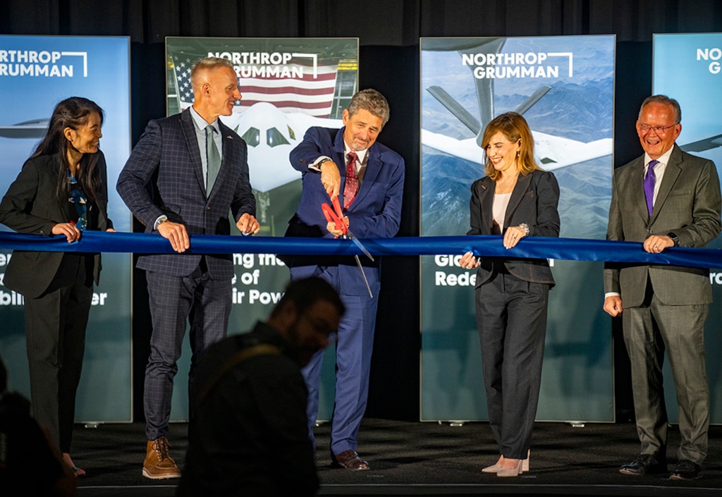 (Rick Egan | The Salt Lake Tribune) Northrop Grumman executive Tom Jones cuts the ribbon at a new manufacturing facility in Layton supporting the B-21 Raider.