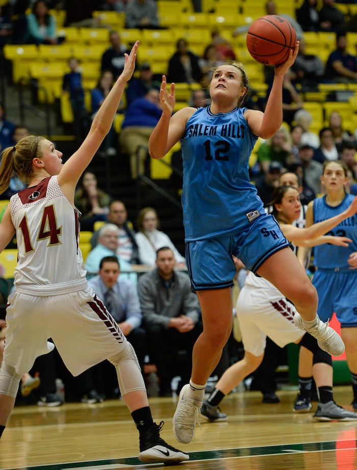 (Francisco Kjolseth  |  The Salt Lake Tribune)  Logan vs Salem Hills, 4A girls State high school semi finals basketball tournament at Utah Valley UniversityÕs UCCU Center, Friday March 2, 2018. Lauren Gustin (12) of Salem Hills shoots past Tori Craner (14) of Logan. 