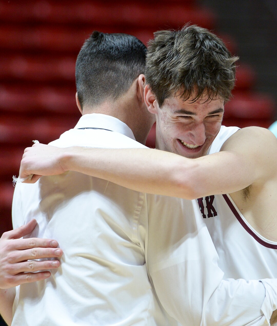 (Leah Hogsten  |  The Salt Lake Tribune) Lone Peak's head coach David Evans hugs Lone Peak's Jaxon Pollard (15). Lone Peak defeated Pleasant Grove 61-44 to win the 6A High School BoysÕ Basketball Tournament Championship at the Jon M. Huntsman Center in Salt Lake City, Saturday, March 3, 2018. 