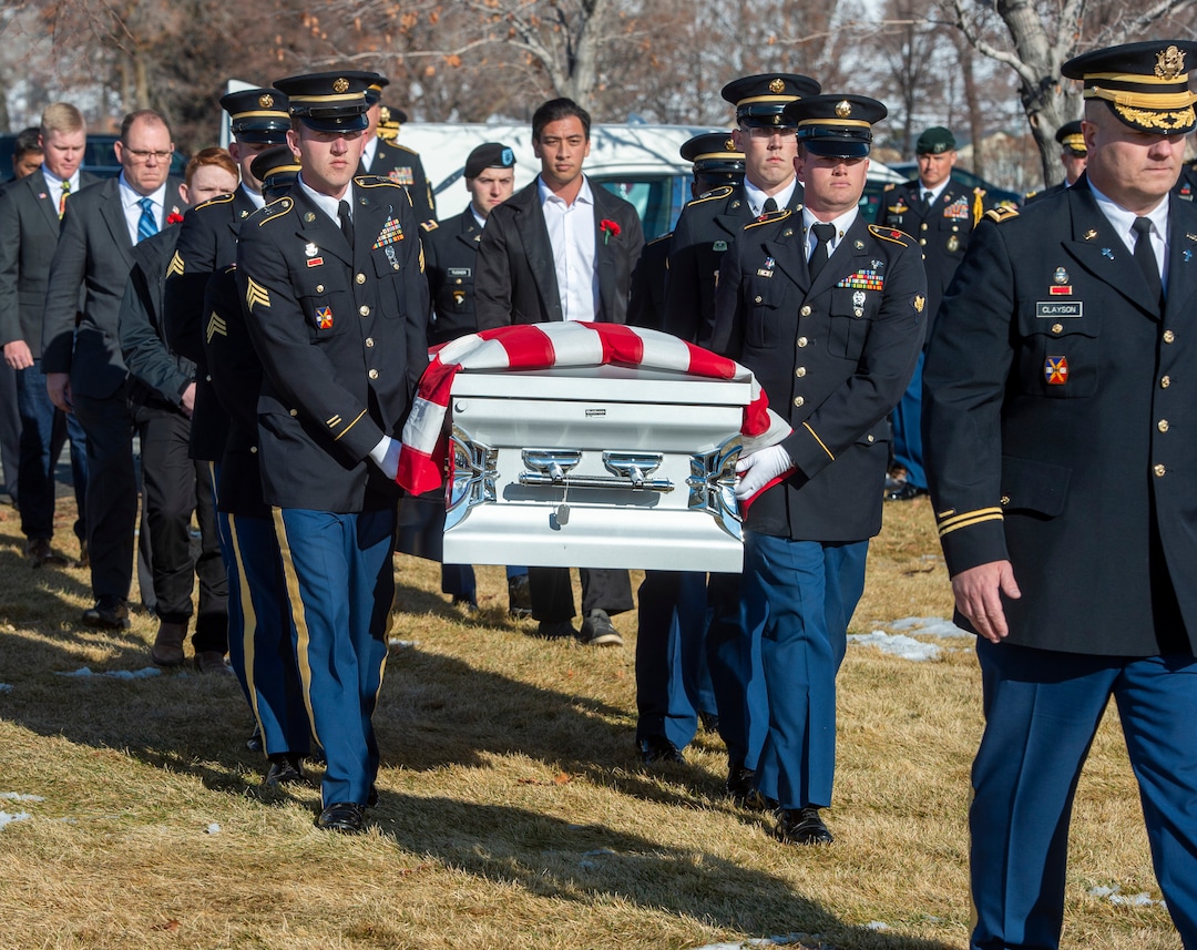 (Rick Egan  |  The Salt Lake Tribune)  The casket of Chief Warrant Officer 2 Kirk T. Fuchigami Jr. is carried into the cemetery by an Honor Guard for the graveside service at the Brigham City Cemetery, Monday, Dec. 9, 2019. Fuchigami was killed in Afghanistan last month.