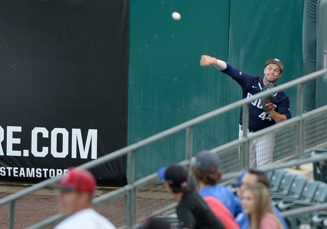 (Francisco Kjolseth  |  The Salt Lake Tribune)  BYU's Brock Hale gets the ball back from the far end of the first base line as Utah and BYU renew their rivalry on the baseball diamond as they battle it out at Smith's Ballpark in Salt Lake City on Tuesday, May 14, 2019.