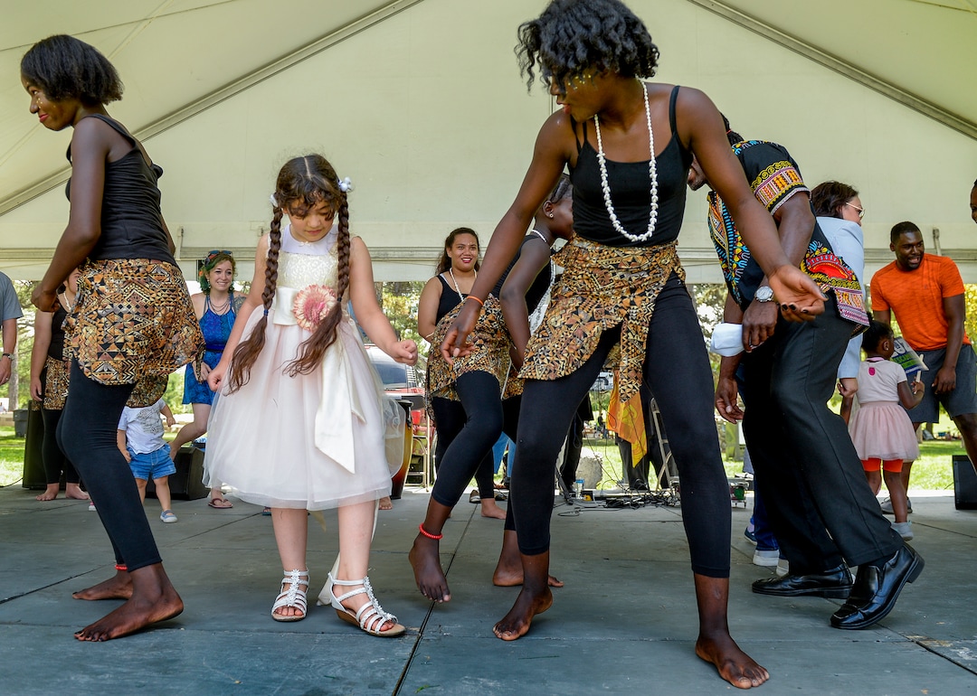 (Leah Hogsten  |  The Salt Lake Tribune) Fatimah Ali learns African dancing from Ornella Ddjoh during the 4th Annual African Festival sponsored by the United Africans of Utah, Saturday, July 27, 2019 at Liberty Park. The African Festival promotes African tradition, culture and heritage through the arts, food fashion, music and dance.