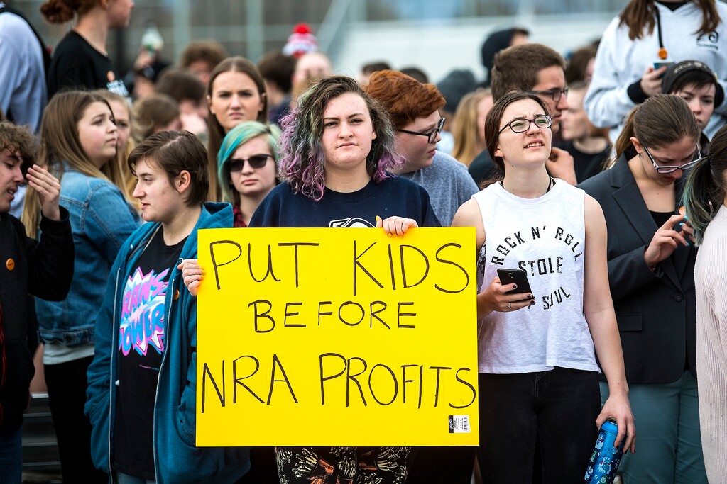 (Chris Detrick | The Salt Lake Tribune) Students at Highland High School in Salt Lake City gather on the football field to participate in a nationwide demonstration for better gun safety laws Thursday, March 15, 2018. Students at more than 30 schools along the Wasatch Front, nearly all of them high schools, particiapted in the 17-minute walkout — one minute for each of the Florida students killed.