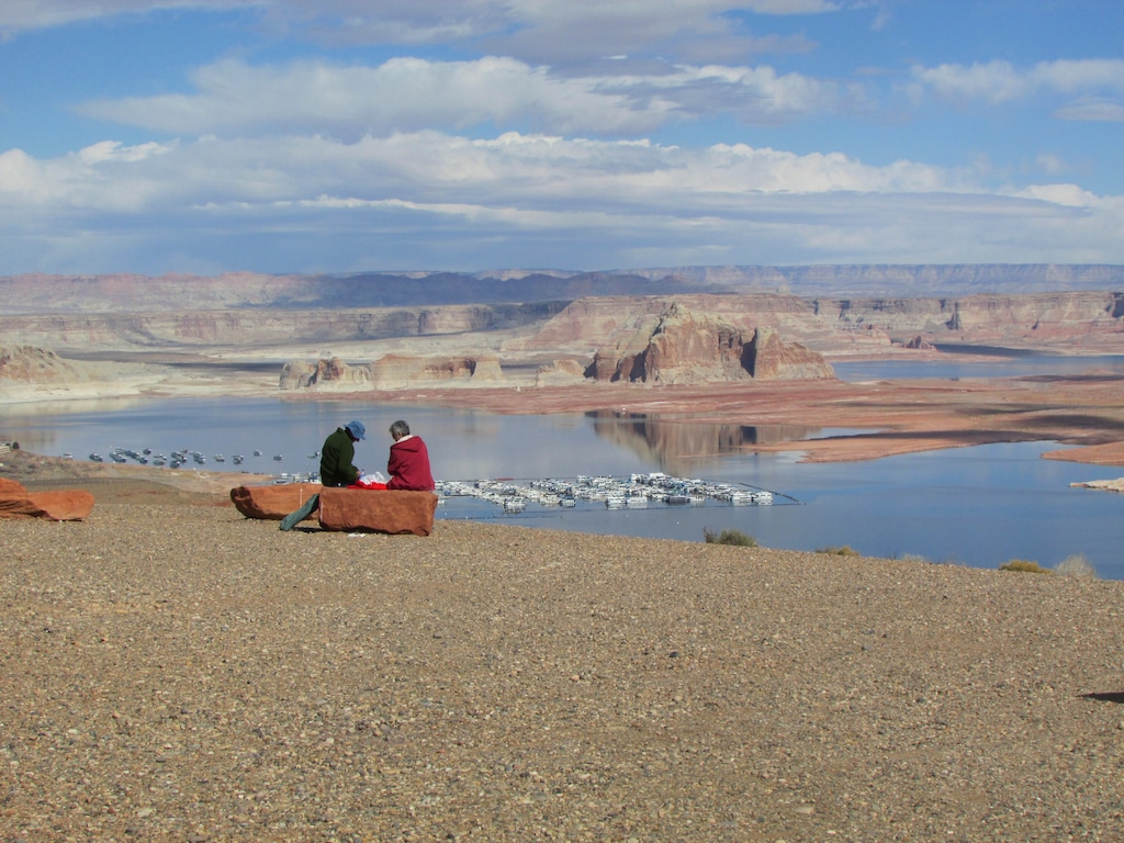 (Tribune File Photo)  A couple enjoys a quiet February lunch at Wahweap overlook at Lake Powell, where there are concerns about low water levels.