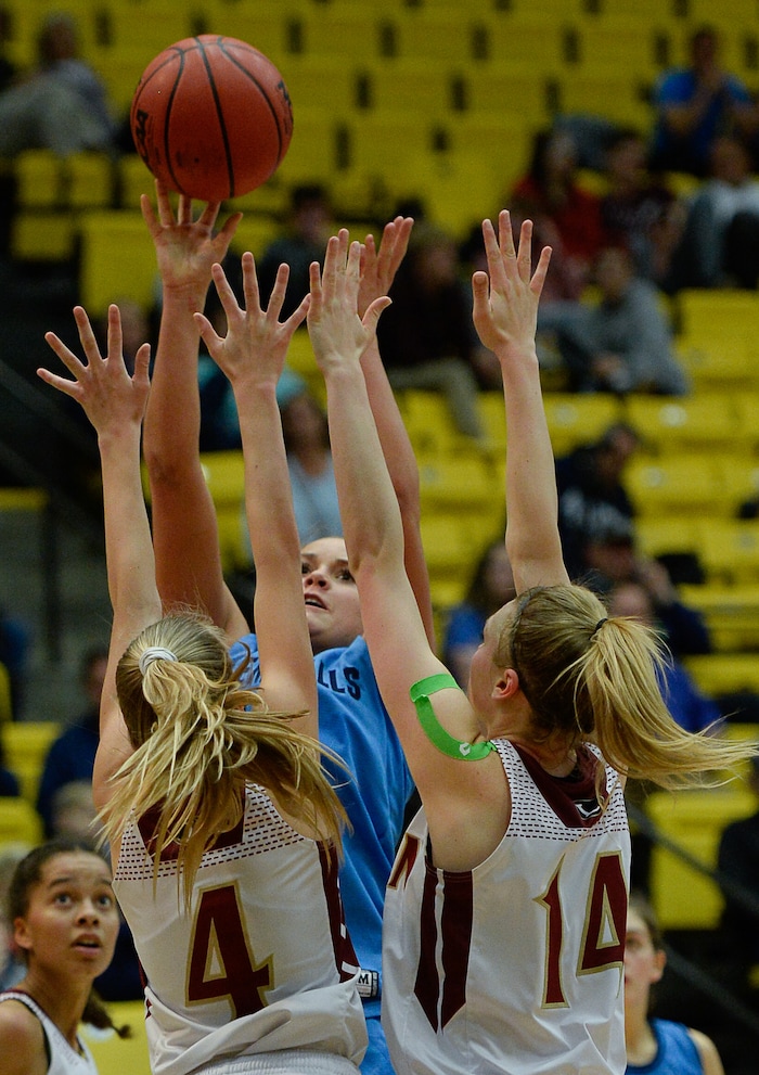 (Francisco Kjolseth  |  The Salt Lake Tribune)  Logan vs Salem Hills, 4A girls State high school semi finals basketball tournament at Utah Valley UniversityÕs UCCU Center, Friday March 2, 2018. Lauren Gustin (12), center, of Salem Hills battles Taylor Rose (4) and Tori Craner (14) of Logan.