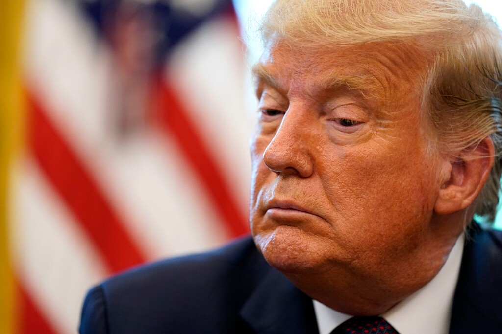 (Andrew Harnik | AP file photo)  President Donald Trump listens in the Oval Office of the White House on Friday, Sept. 11, 2020, in Washington.