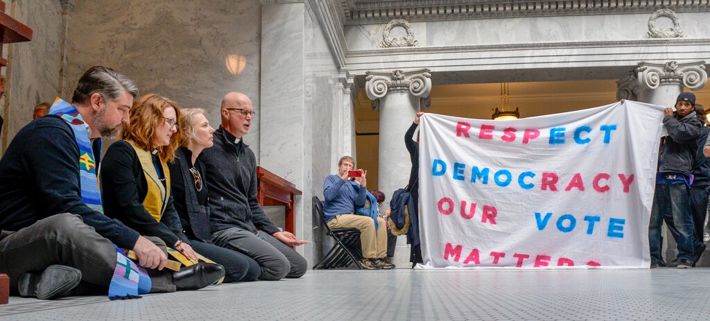 (Leah Hogsten | Tribune file photo) Faith leaders l-r Rev. Curtis Price with The First Baptist Church of Salt Lake City, Rev. Monica Dobbins with the First Unitarian Church of Salt Lake City, Zen Buddhist Anna Zumwalt and Pastor David Nichols with Mt. Tabor Lutheran Church demonstrate in opposition to SB96 outside the Utah House chambers, Feb. 8, 2019. SB96 replaced a voter-approved Medicaid expansion initiative with a partial expansion plan that covers fewer low-income Utahns.