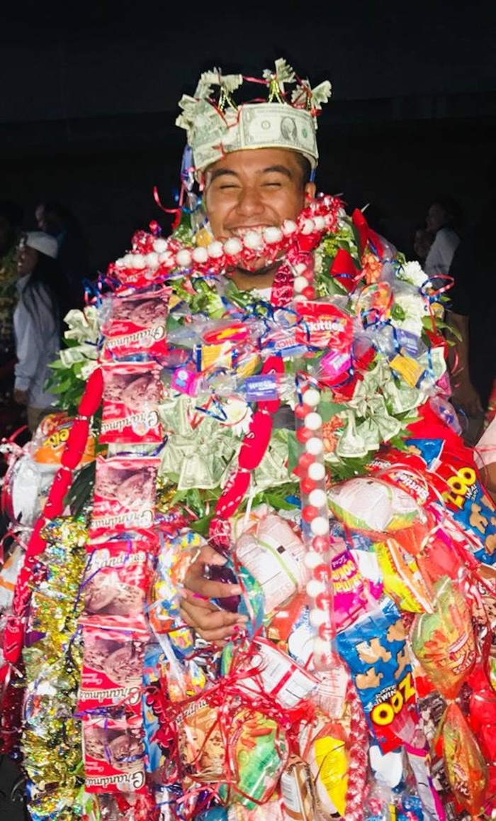 (Courtesy of M. Vida Hafoka) Taavili PO Hafoka graduated from East High School in Salt Lake City on Wednesday, June 6, 2018. He has South Pacific heritage but was banned from wearing leis during his ceremony at the Huntsman Center. Pacific Islander students, when allowed, typically wear one or two fresh leis during their graduation to honor their heritage. Relatives then pile more on after the ceremony, in celebration.