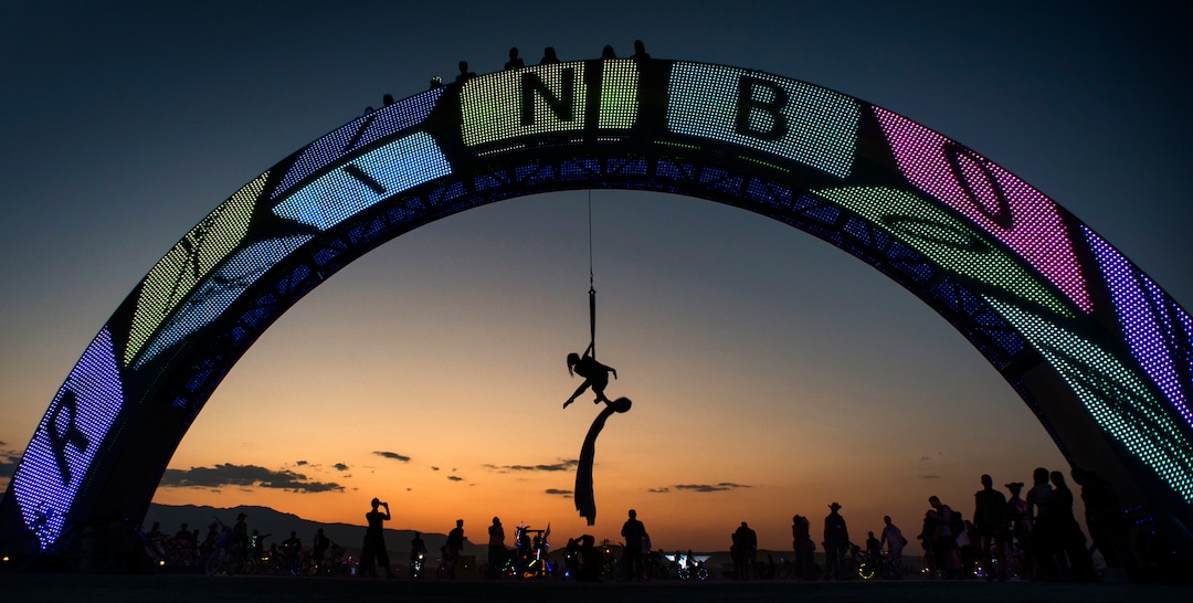 (Rick Egan  |  The Salt Lake Tribune)    Lisa Caraway from Los Angeles, performs aerial acrobatics, suspended from the Rainbow Bridge, at Burning Man, during Burning Man, a week long celebration of art and radical self expression, in the Black Rock Desert in Nevada, Saturday, Sept. 1, 2018.