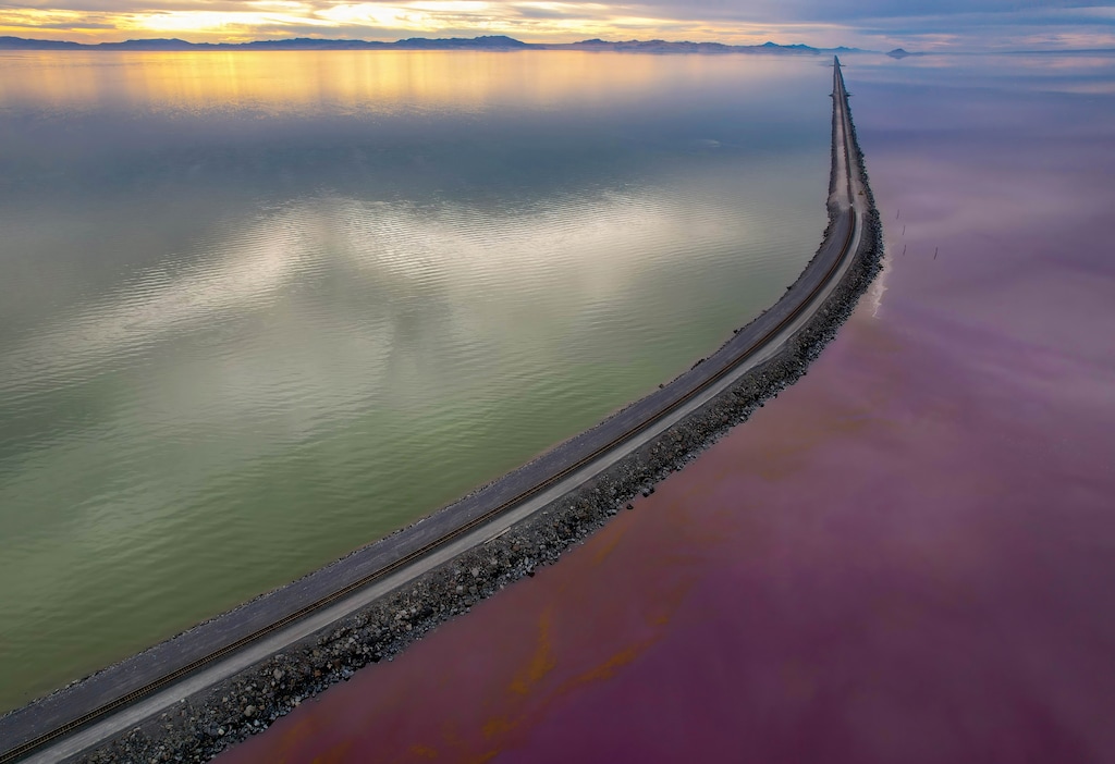 (Francisco Kjolseth|The Salt Lake Tribune) The Union Pacific rock-fill railroad causeway stretches 20 miles across the Great Salt Lake, splitting the lake in two, on Friday, Nov. 22, 2024. New research shows how much water must be saved to restore the lake to a healthy level in the next 10 years.