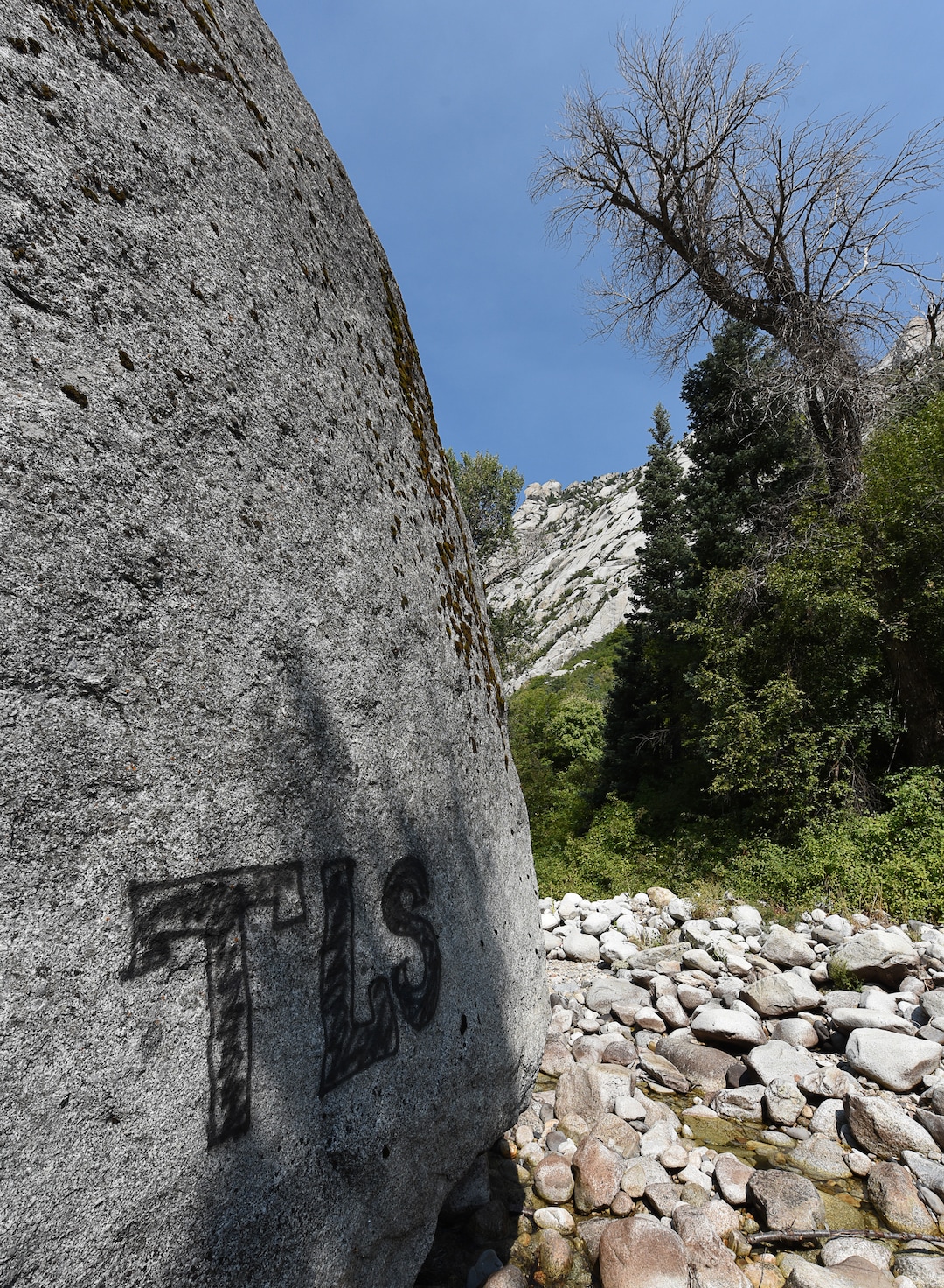 (Francisco Kjolseth  |  The Salt Lake Tribune)  Graffiti has proliferated in lower Little Cottonwood Canyon, where vandals, often wielding cans of fluorescent-colored spray paint, have covered granite faces, trees and structures. The vandalism is particularly apparent along the Temple Quarry Trail and the creek at the Moon Rock swimming hole and former pavilion site. Volunteers using donated equipment and solvents spend thousands of hours removing the paint from the rocks only to see graffiti return to the same faces or on rock nearby.