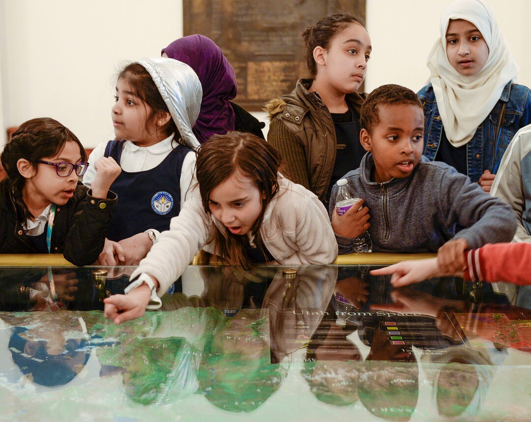 (Leah Hogsten  |  The Salt Lake Tribune)  Students from Iqra Academy of Utah inspect a topographic map of Utah during the Utah Muslim Civic League inaugural Muslim Day on the Hill, Feb. 25, 2020 at the Capitol.
