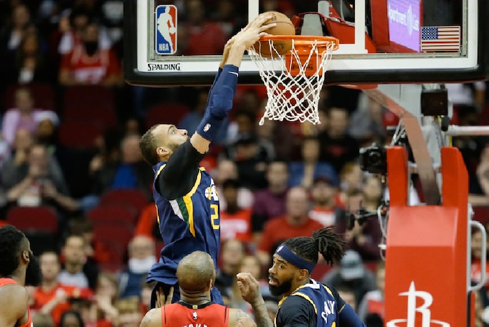 Utah Jazz center Rudy Gobert (27) dunks during the first half of an NBA basketball game against the Houston Rockets, Sunday, Feb. 9, 2020, in Houston. (AP Photo/Eric Christian Smith)