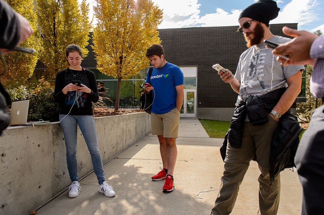(Trent Nelson | The Salt Lake Tribune)  Nickie Zenes, Andrew Moore, and Russel Davis participate in a Pokemon Go raid with other players at the University of Utah in Salt Lake City on Thursday, Oct. 19, 2017.