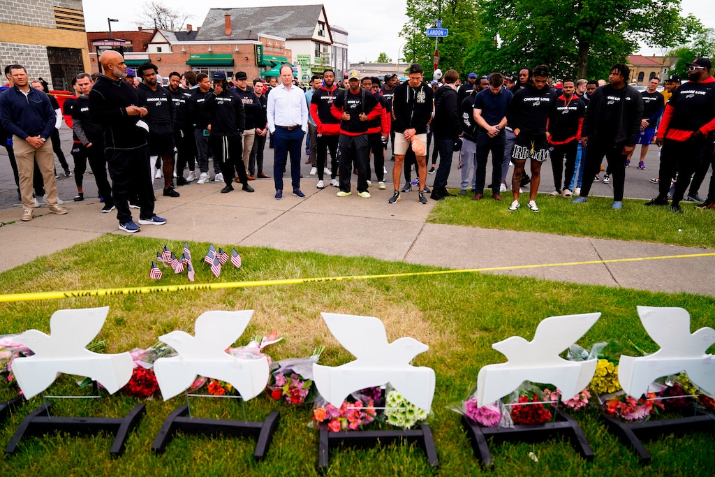 (Matt Rourke | AP) Members of the Buffalo Bills visit the scene of Saturday's shooting at a supermarket, in Buffalo, N.Y., Wednesday, May 18, 2022.