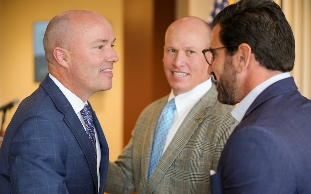 (Chris Samuels | The Salt Lake Tribune) Gov. Spencer Cox, left, and Joel Ferry, center, executive director of the Department of Natural Resources, greet Rick Springman, president of global clean energy opportunities at Holtec International, at an event in Brigham City, Monday, Nov. 17, 2025. Cox announced plans to build a training center and nuclear manufacturing plant in Brigham City.