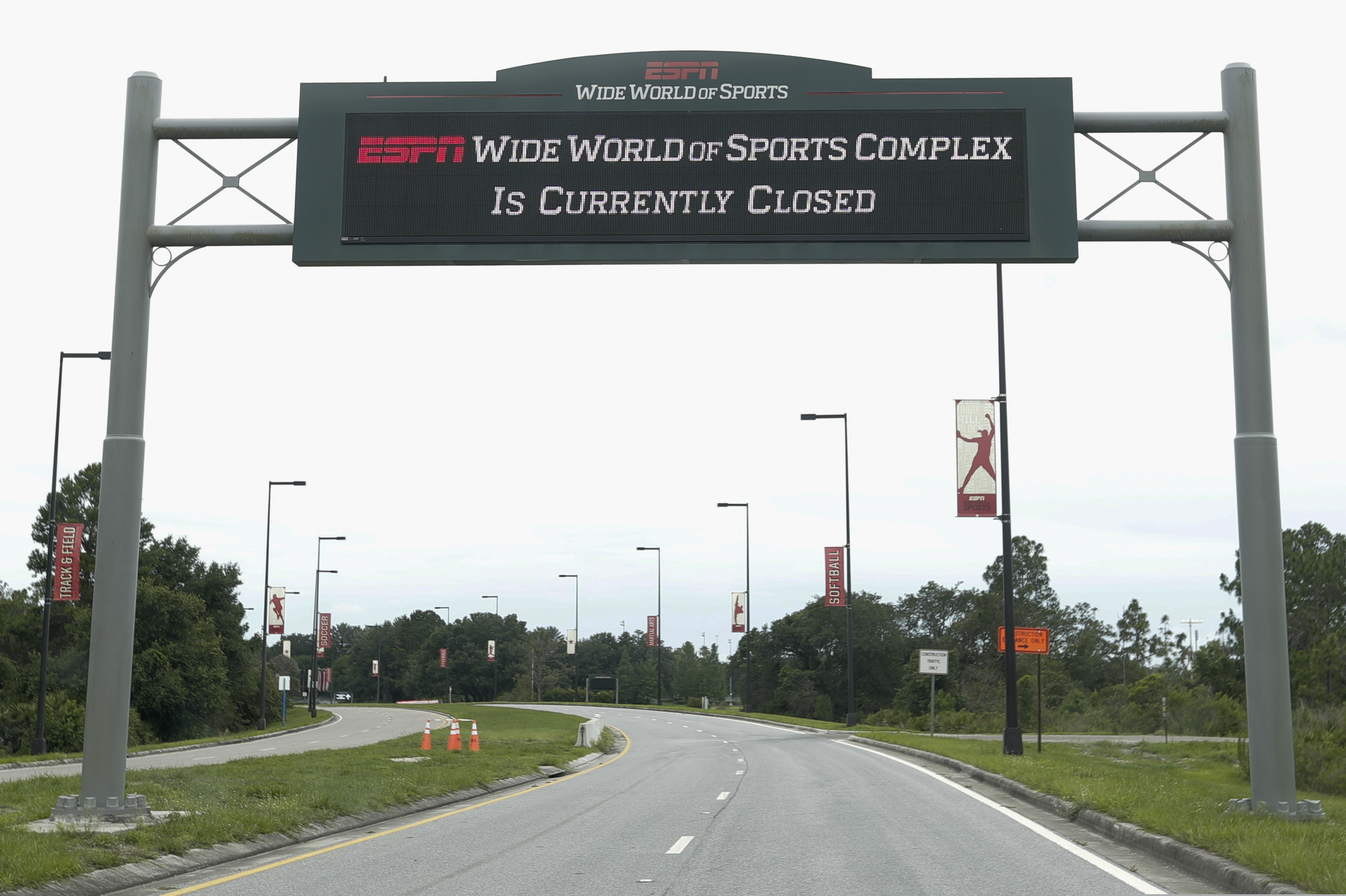 A sign at the entrance to ESPN's Wide World of Sports at Walt Disney World is seen Wednesday, June 3, 2020, in Kissimmee, Fla. The NBA has told the National Basketball Players Association that it will present a 22-team plan for restarting the season at Disney. (AP Photo/John Raoux)