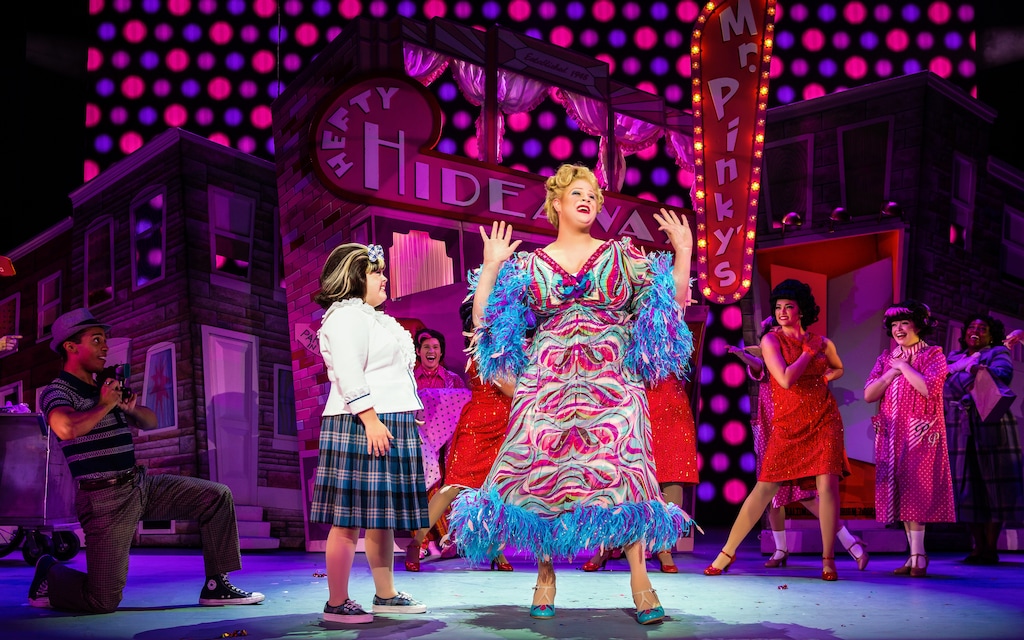 (Jeremy Daniel |  Broadway Across America) Andrew Levitt, aka Nina West from "RuPaul's Drag Race," center, plays Edna Turnblad, with Niki Metcalf as his daughter Tracy, in the touring production of the musical "Hairspray." The touring show, with Levitt in the lead, is scheduled to play at Salt Lake City's Eccles Theater from April 11 to 16, 2023, as part of the Broadway at the Eccles season.