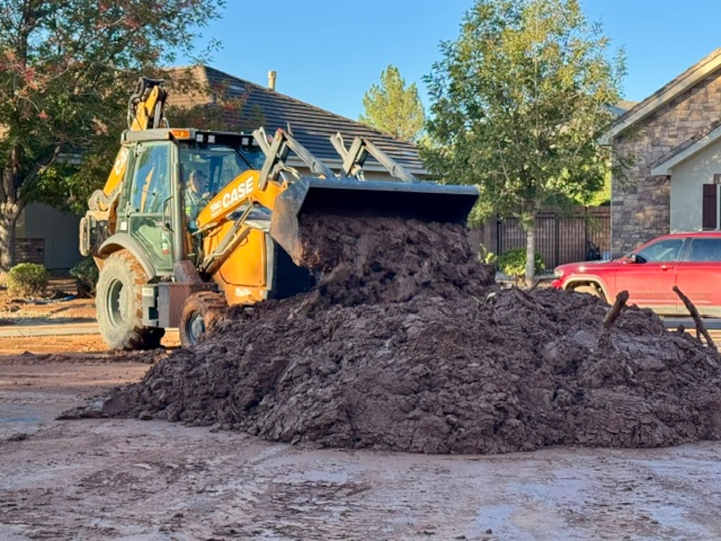 (Mark Eddington | The Salt Lake Tribune) Mud and debris washed through a Hurricane neighborhood after a storm system brought heavy rains to the southwest Utah on Oct. 22.