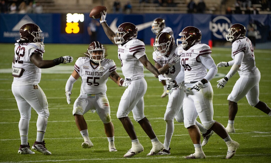 (Francisco Kjolseth  |  The Salt Lake Tribune) Texas State Bobcats linebacker Hal Vinson (8) celebrates a fumble recovery by BYU quarterback Zach Wilson (1) but the Texas was unable to score past the the BYU defense in NCAA college football game at LavVell Edwards Stadium, Saturday, oct. 24, 2020, in Provo, Utah.