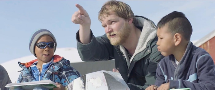 (Courtesy Sundance Institute) Anders Hvidegaard (center), a Danish teacher, tries to make friends with the locals, like student Asser Boassen (left), in Samuel Collardey's "A Polar Year," which will screen in the World Cinema Documentary competition of the 2018 Sundance Film Festival.