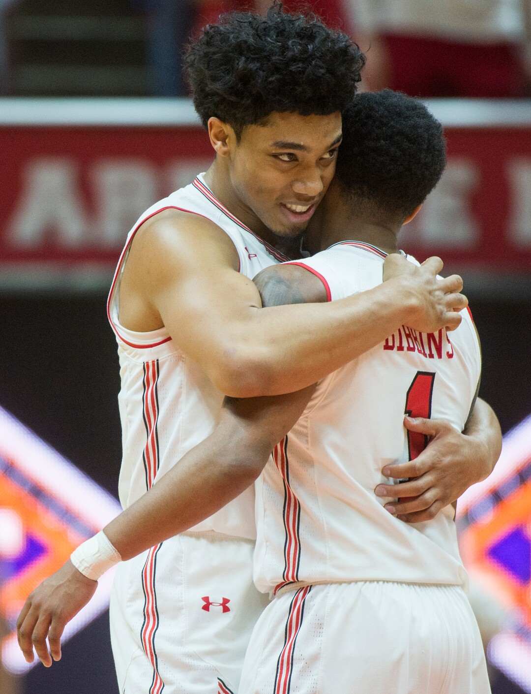 (Rick Egan  |  The Salt Lake Tribune)   Utah Utes guard Sedrick Barefield (0) hug Utah Utes guard Justin Bibbins (1)as the Utes take a big lead in the 4th quarter, in NIT playoff action between Utah Utes and LSU Tigers at the Jon M. Huntsman Center, Monday, March 19, 2018.