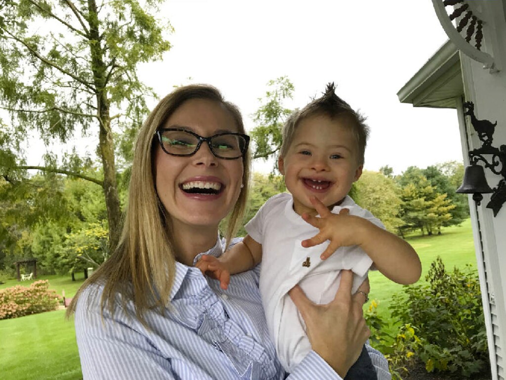 Julie Carr Smyth | The Associated Press. In this undated photo, Kelly Kuhns holds her son, Oliver, in Plain City, Ohio. Kuhns is advocating for an Ohio bill that would ban abortions based on the type of pre-natal Down syndrome diagnosis she received for her son, Oliver.