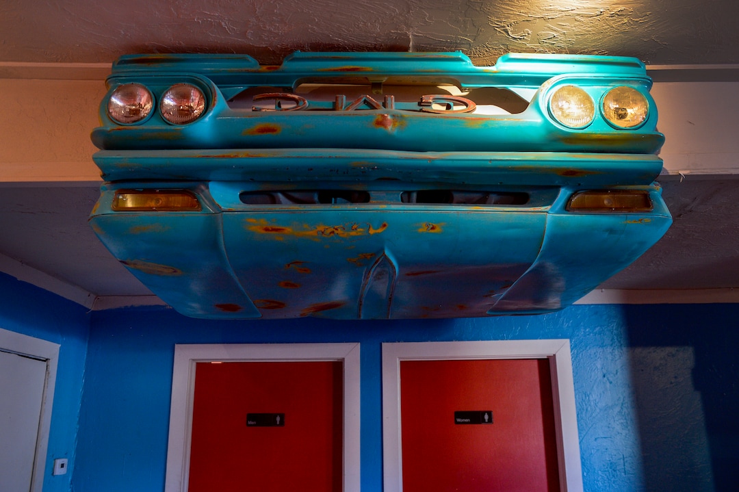 (Leah Hogsten  |  The Salt Lake Tribune) The hood of a GMC car hangs from the ceiling, a remnant of when the space used to be a bar called The Woodshed. Pasha Middle Eastern Cuisine specializes in a fusion of Moroccan, Mediteranean and Middle Eastern dishes, Aug. 14, 2019.