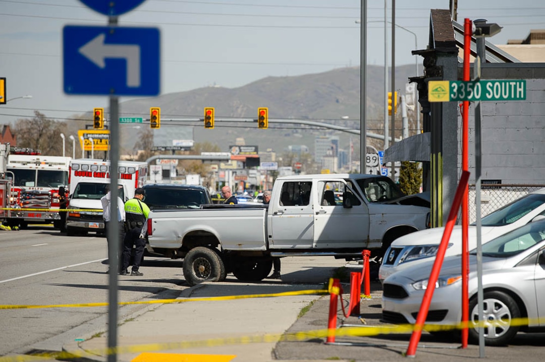 (Trent Nelson  |  The Salt Lake Tribune)  Law enforcement at the scene of a shootout near 3300 South State Street in South Salt Lake on Monday April 8, 2019.