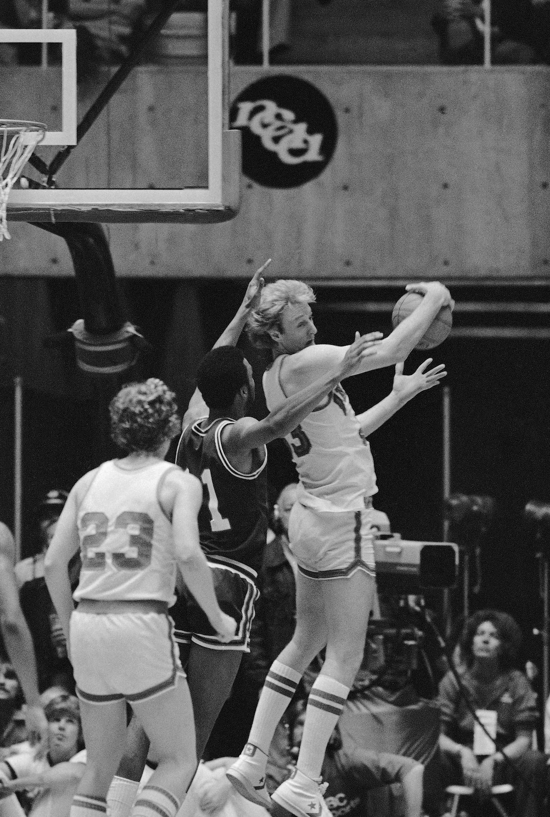 (AP Photo) Indiana State's Larry Bird, who put on an offensive show with 35 points, also played defense as he hauls  down a rebound away from the outstretched hands of DePaul's James Mitchem during their NCAA semi-final game Saturday March 24, 1979 in Salt Lake City. Indiana State's Steve Reed awaits outcome. Indiana State won, the game 76-74. 