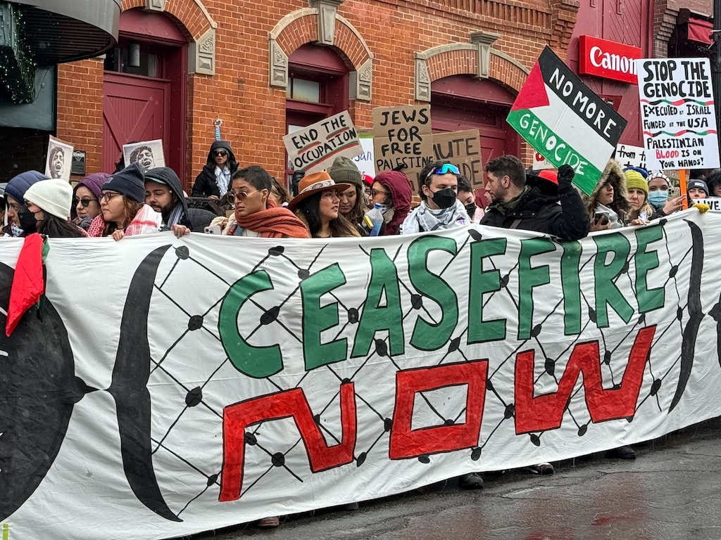 (Alex Vejar  |  The Salt Lake Tribune) Marchers hold a "Ceasefire Now" banner in a pro-Palestinian protest that drew dozens of attendees on Park City's Main Street during the 2024 Sundance Film Festival, Jan. 21, 2024.