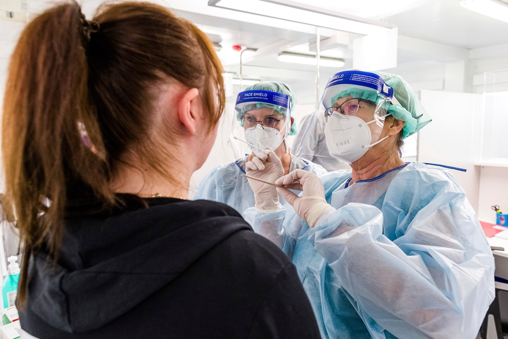 (Markus Scholz | dpa via AP file photo)  A doctor takes a swab sample to test for the coronavirus at test center in Hamburg, Germany, Sept. 3, 2020.