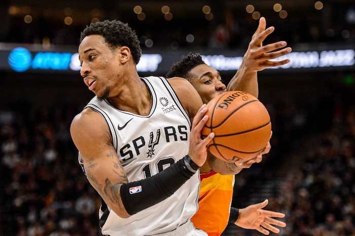 (Trent Nelson | The Salt Lake Tribune)  
Utah Jazz guard Donovan Mitchell (45) goes for the steal but San Antonio Spurs guard DeMar DeRozan (10) holds onto the ball as the Utah Jazz host the San Antonio Spurs, NBA basketball in Salt Lake City on Saturday Feb. 9, 2019.
