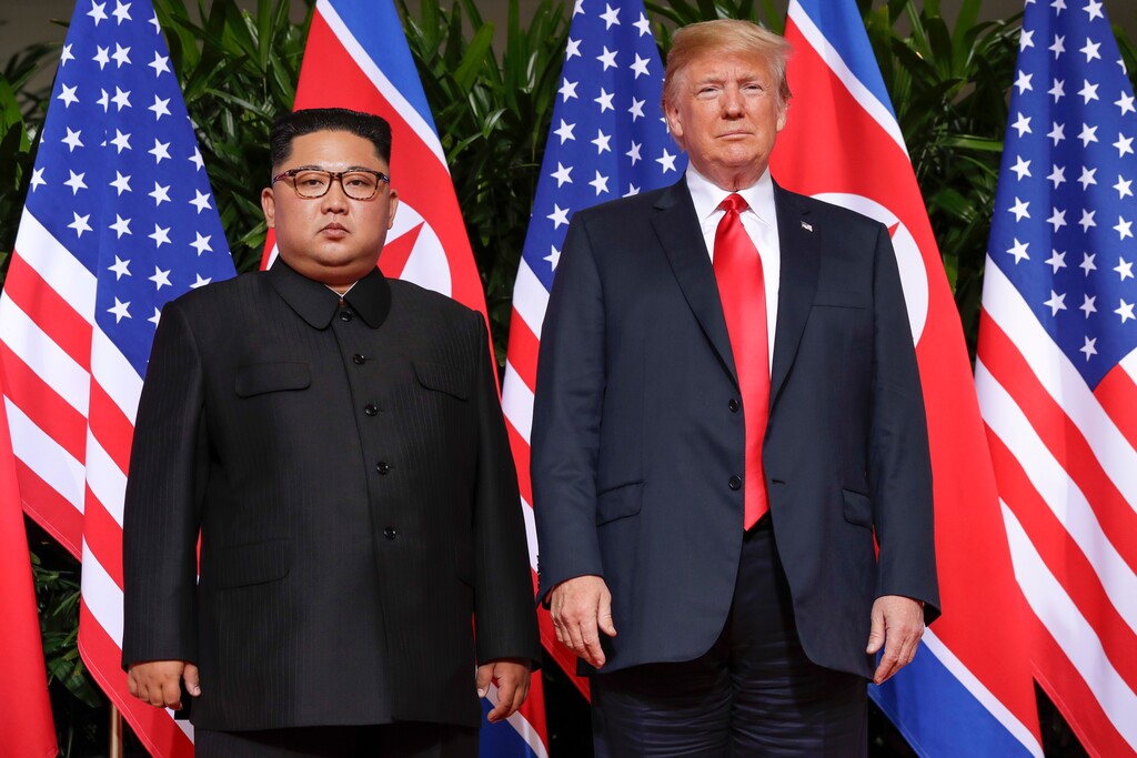 (Evan Vucci | The Associated Press) U.S. President Donald Trump stands with North Korea leader Kim Jong Un for a photograph at the Capella resort on Sentosa Island Tuesday, June 12, 2018 in Singapore.