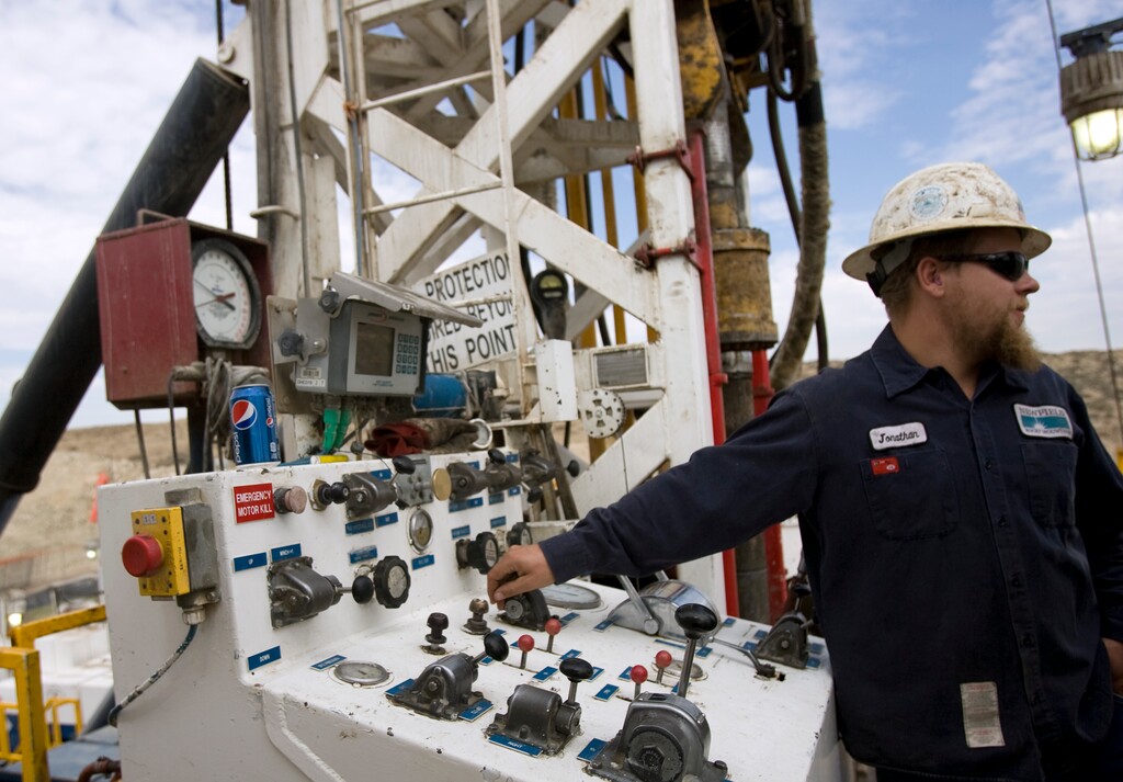 |  Tribune File PhotoJonathan Varelman mans the controls on a super single oil rig's drilling platform  in the Newfield Exploration Company's oil fields in Monument Butte near Roosevelt, Utah on August 9, 2012.