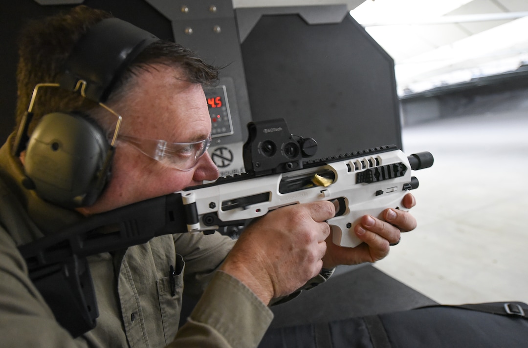 (Francisco Kjolseth  |  The Salt Lake Tribune)  Utah gun rights advocate Clark Aposhian, fires a Glock 22, 40 caliber hand gun cradled inside a Micro-Roni Stabilizer gun accessory while discussing gun laws recently at a shooting range in Murray. Aposhian is one of only a handful of Americans who are legally allowed to keep their bump stock, a shooting accessory that alters semi-automatic rifles to fire in quick bursts like a machine gun. He is challenging the bump stock ban in court, and an appeals court has allowed him to keep his bump stock until his case is resolved in court.