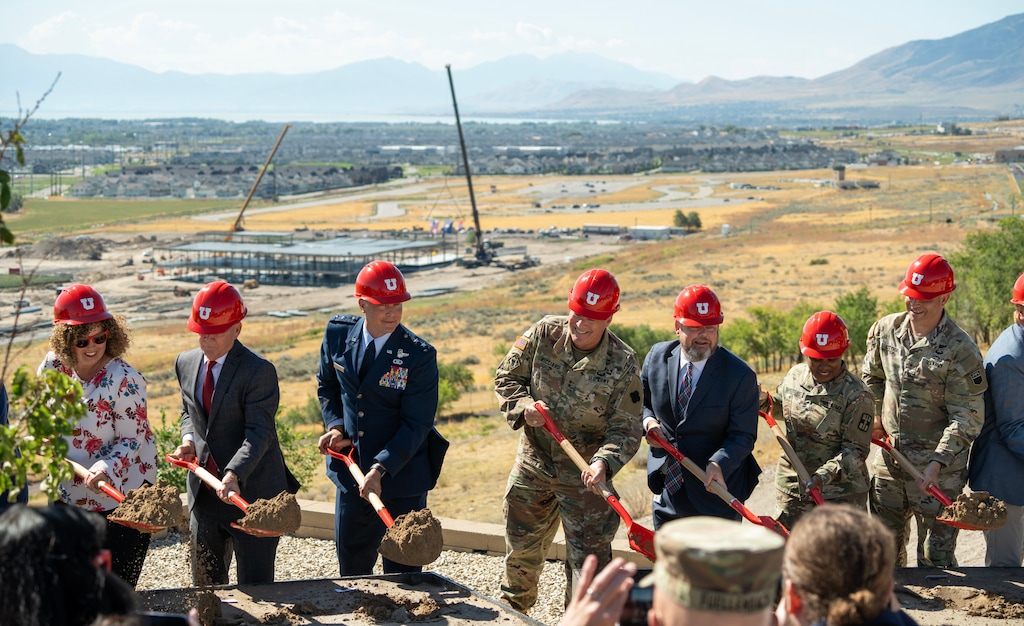 (Chris Samuels | The Salt Lake Tribune) Dignitaries turn dirt at Camp Williams in Bluffdale, Monday, Aug. 19, 2024, at a groundbreaking ceremony for a new U.S. Army Reserve facility, below, which will replace Ft. Douglas near the University of Utah.