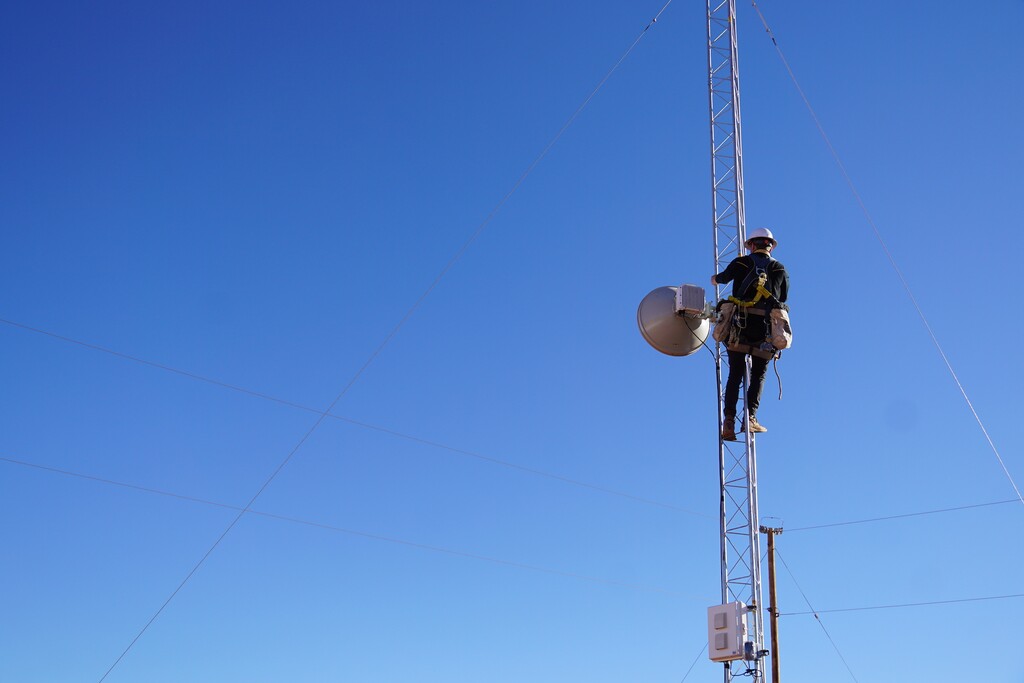 (Zak Podmore | The Salt Lake Tribune) Nathan Berry, a tower technician, works to bring internet to students in southern San Juan County on December 8, 2020.