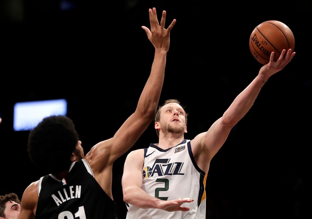 Utah Jazz forward Joe Ingles (2) goes up for a shot against Brooklyn Nets center Jarrett Allen (31) during the second half of an NBA basketball game, Wednesday, Nov. 28, 2018, in New York. The Jazz won 101-91. (AP Photo/Julio Cortez)