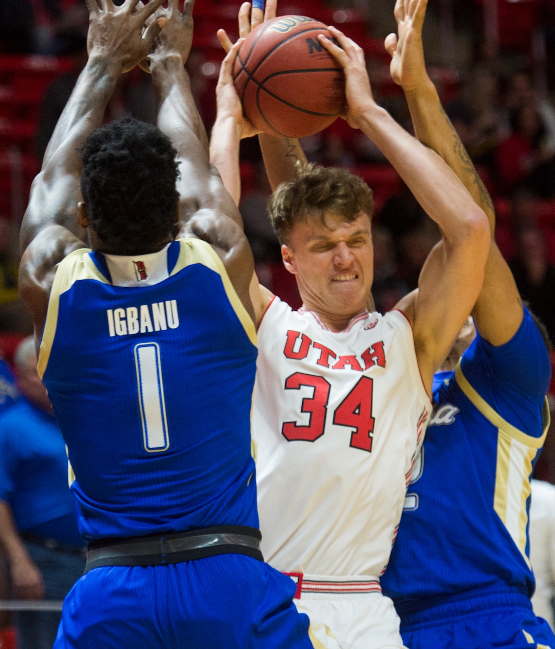 (Rick Egan  |  The Salt Lake Tribune)    Utah Utes center Jayce Johnson (34) tries to get a shot as Tulsa forward Martins Igbanu (1) and Tulsa guard DaQuan Jeffries (2) defend for the Golden Hurricane's,  in basketball action between, Utah Utes and Tulsa Golden Hurricane, at the Jon M. Huntsman Center, Saturday, Dec. 1, 2018.