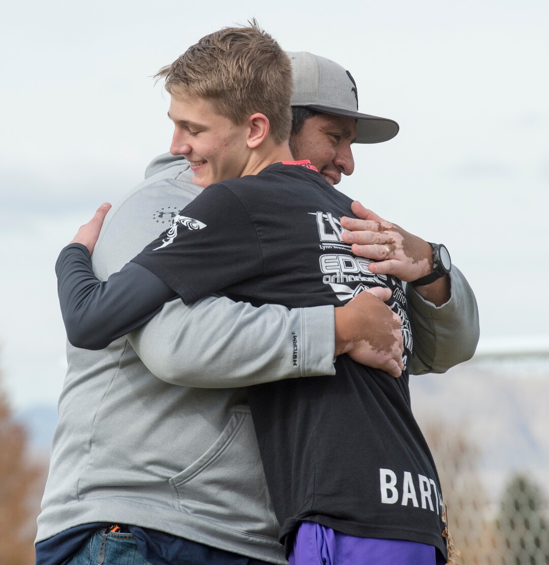 (Rick Egan | The Salt Lake Tribune) Box Elder lacrosse coach Juan Gaytan hugs player Justin Barthold during a lacrosse tournament in Logan on Saturday, Nov. 3, 2018.