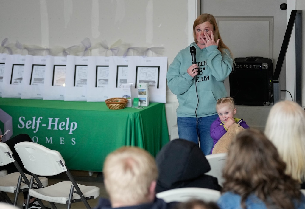 (Francisco Kjolseth | The Salt Lake Tribune) McKeil Mahoney sheds tears of joy alongside her daughter Camryn, 3, as they get ready to move into their new home in Heber City, on Thursday, April 2, 2026. Mahoney spoke about the Self-Help Housing community that helps families build and move into new homes.