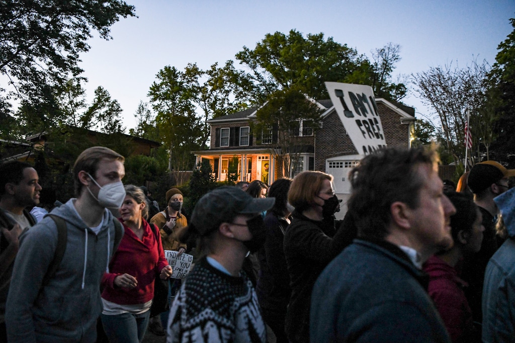 (Kenny Holston | The New York Times)
Demonstrators march to Justice Samuel Alito’s house for a candlelight vigil as part of an abortion rights protest in Alexandria, Va., on Monday, May 9, 2022. The Supreme Court has voted to strike down the landmark Roe v. Wade decision, according to a leaked initial draft majority opinion written by Justice Samuel Alito that was published by Politico on May 2, 2022.