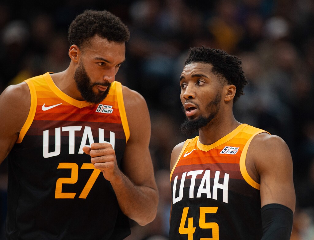 (Rachel Rydalch | The Salt Lake Tribune) Rudy Gobert, left, and Donovan Mitchell, right, talk mid-game versus the Dallas Mavericks in Salt Lake City on Friday, Feb. 25, 2022.