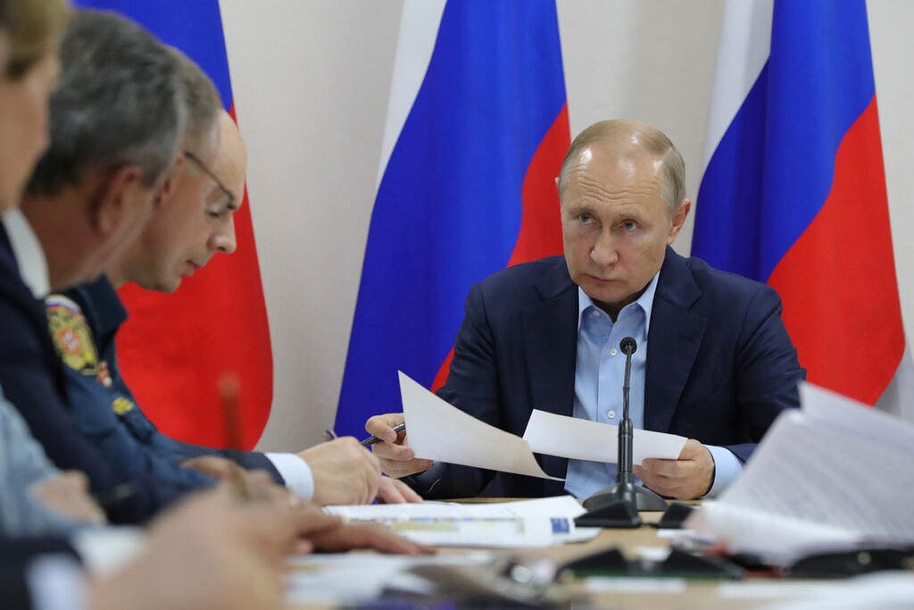 Russian President Vladimir Putin chairs a meeting with local authorities and heads of federal agencies on the emergency situation about heavy floods in Irkutsk region in Bratsk, Russia, Saturday, June 29, 2019. According to the latest data of the regional emergency command center, the flood has affected 48 settlements of five municipal districts of the region. A source in the emergency services told TASS on Saturday that as a result of the flood in the region five people died and several were reported missing. (Mikhail Klimentyev, Sputnik, Kremlin Pool Photo via AP)