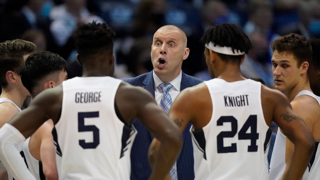 BYU coach Mark Pope speaks with players during the first half of the team's NCAA college basketball game against Gonzaga on Saturday, Feb. 5, 2022, in Provo, Utah. (AP Photo/Rick Bowmer)